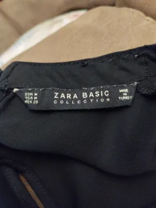 Camisa negra con escote brillante