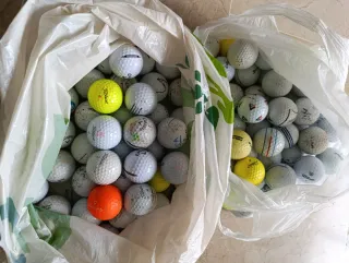 100 pelotas de golf usadas