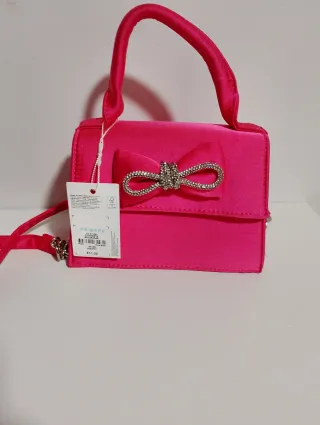 Bolso rosa con lazo y pedrería