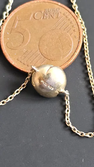 Pulsera bañada en oro con piedra morada