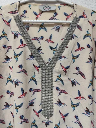 Blusa oversize estampado pájaros
