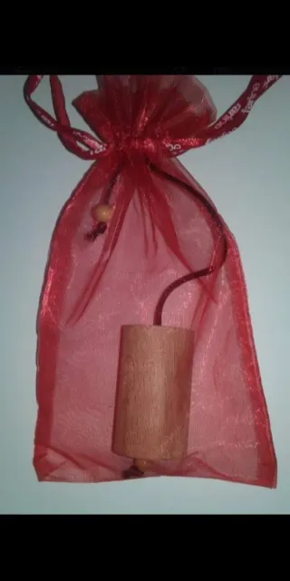 Péndulo de madera con bolsa