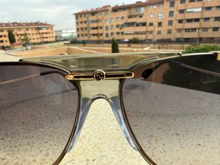 Occhiali da sole Gucci grigio azzurro e dorati