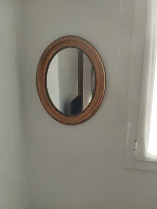 Due specchi decorativi in legno e dorato