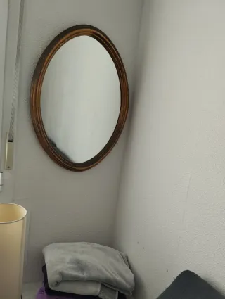 Due specchi decorativi in legno e dorato