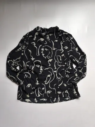 Blusa estampada caras blanco y negro