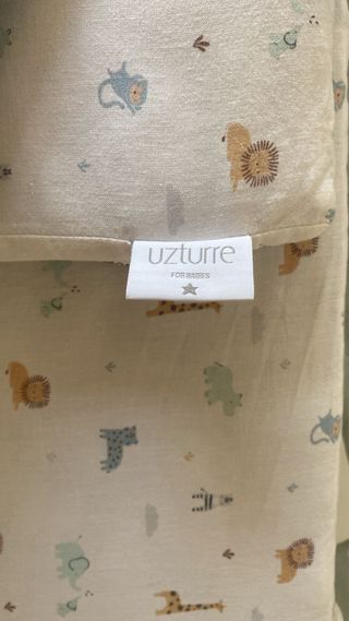 Minicuna bebé blanca con ruedas