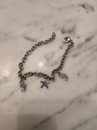 Bracciale donna con ciondoli cavallucci e stella