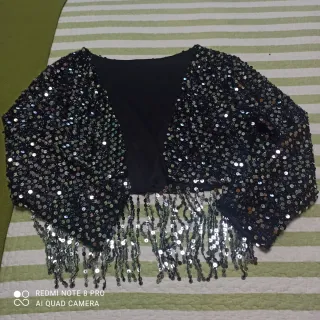 Torera lentejuelas flecos