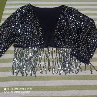 Torera lentejuelas flecos