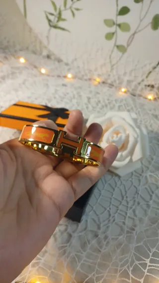 Pulsera Hermès Dorada y Naranja Cierre Click