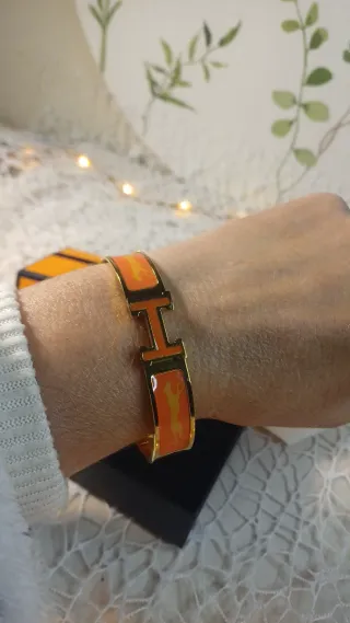 Pulsera Hermès Dorada y Naranja Cierre Click