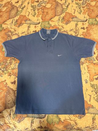 Polo Nike blu con righe bianche