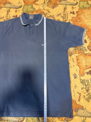 Polo Nike blu con righe bianche