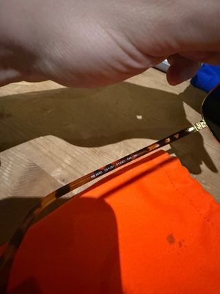 Gafas de sol Ray-Ban doradas y negras