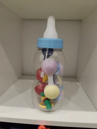 Biberón con sonajeros para bebé