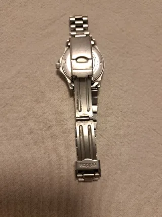 Reloj Adidas Plata y Azul está Parado