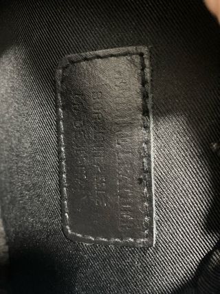 Bolso redondo de piel, estampado serpiente y negro