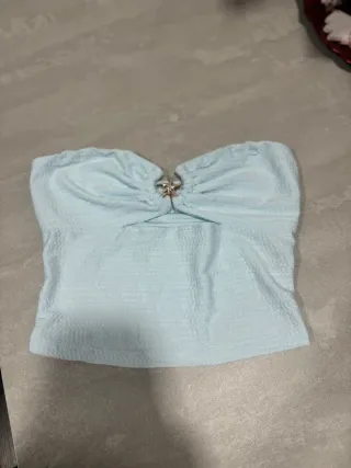 Top azul con detalle de estrella