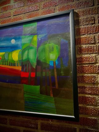 Grande quadro con cornice nera in legno multicolore