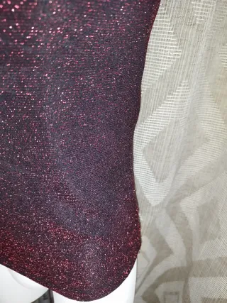 Top fiesta brillante cuello alto sin mangas