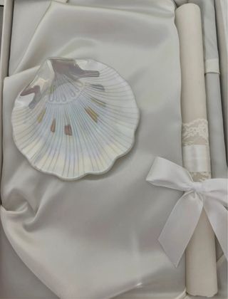 Concha y vela de bautismo