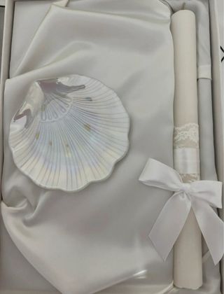 Concha y vela de bautismo