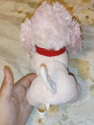 Peluche cane rosa con collare rosso