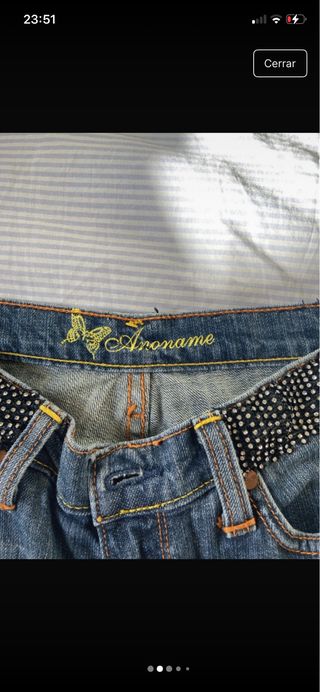 Jeans vintage a vita bassa con cintura brillante