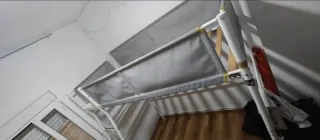 Cama alta metálica y de tela