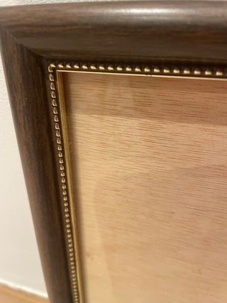 Elegante cornice in legno e metallo dorato