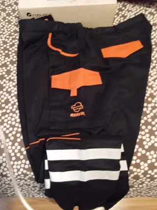 Pantalón de trabajo iturri negro/naranja de repsol