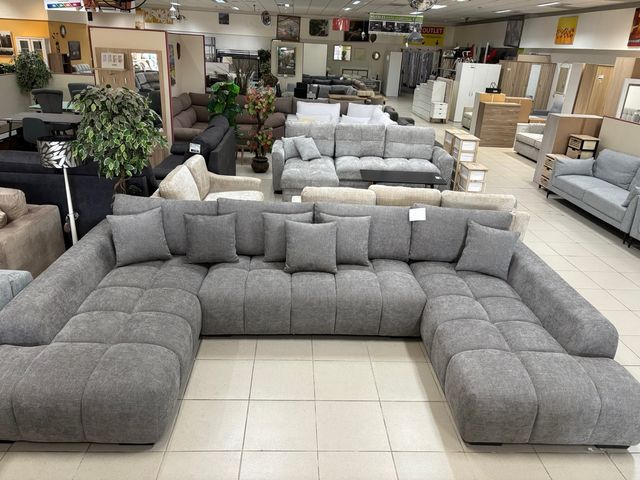 Sofá modular gris con doble chaise longue