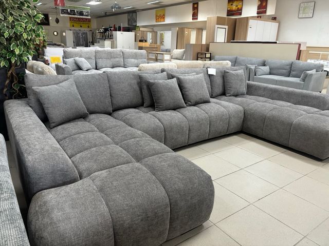 Sofá modular gris con doble chaise longue