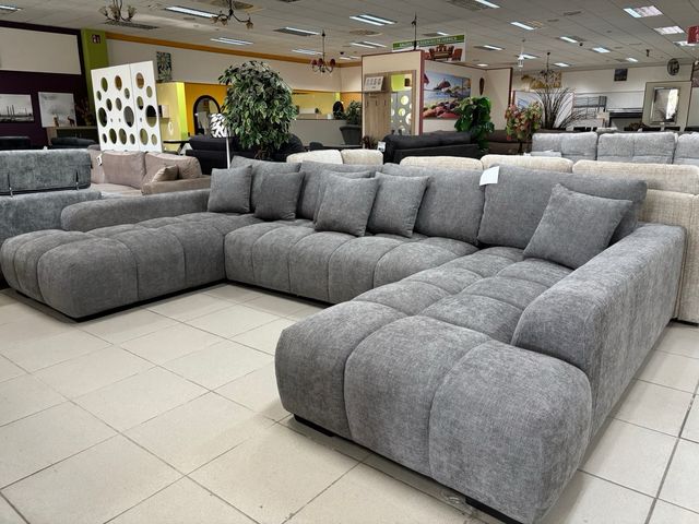 Sofá modular gris con doble chaise longue