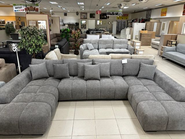 Sofá modular gris con doble chaise longue