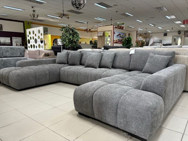 Sofá modular gris con doble chaise longue