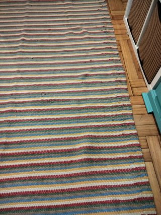 Alfombra 90% algodón 10% poliéster.