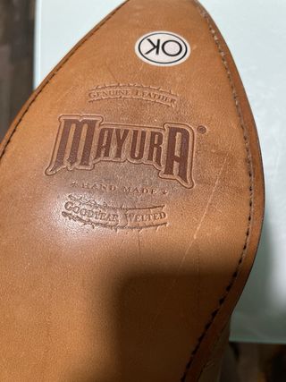 Botas de piel estilo cowboy beige y marrón