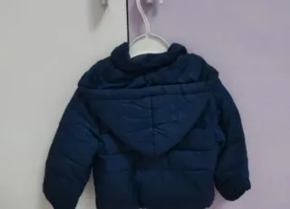 Piumino bambina blu con fiocchi