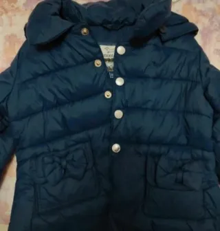 Piumino bambina blu con fiocchi