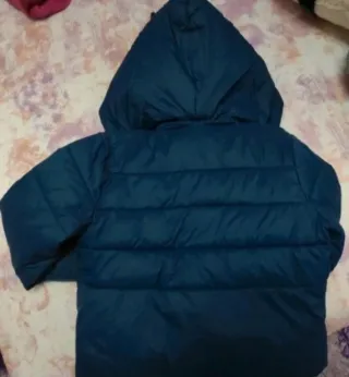 Piumino bambina blu con fiocchi