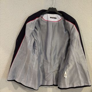 Americana mujer azul marino.