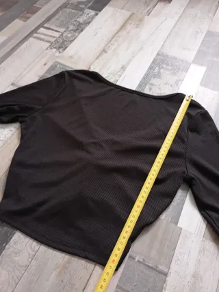 Jersey negro manga larga retorcido