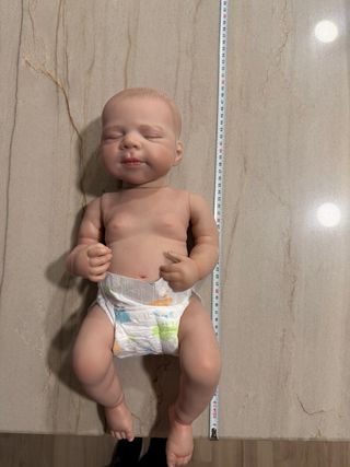 Carrito de juguete marino y rosa con bebé