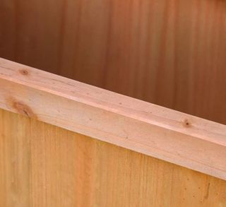 Macetero de madera con soporte trepador