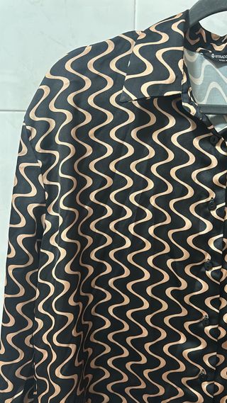 Blusa ondas negro y dorado