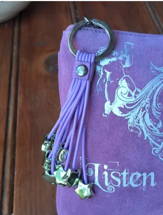 Neceser morado con corazón y estrellas