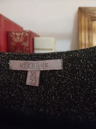 Vestido fiesta brillo negro y dorado.