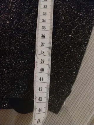 Vestido fiesta brillo negro y dorado.